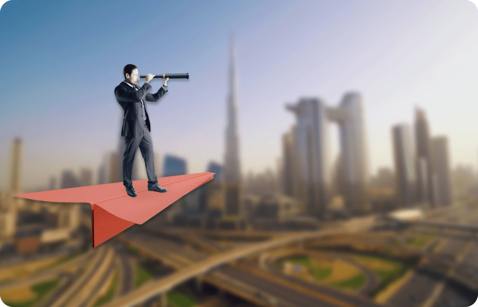 Vision - man looking through telescope over city skyline